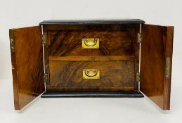 A Rosewood smokers box, two drawers enclosed by two doors with key. 29 L x 18 D x 22H