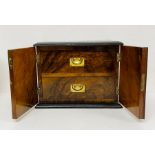 A Rosewood smokers box, two drawers enclosed by two doors with key. 29 L x 18 D x 22H