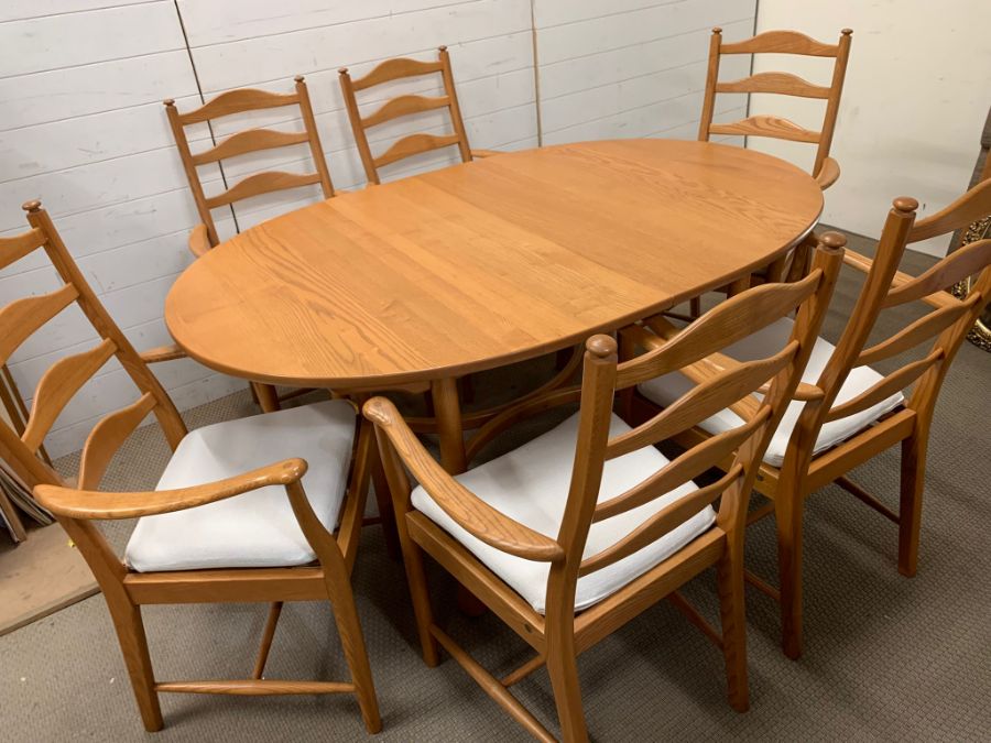 An Ercol dining table and six ladder back chairs - Image 4 of 7