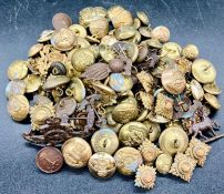 A volume of military cap badges, button etc