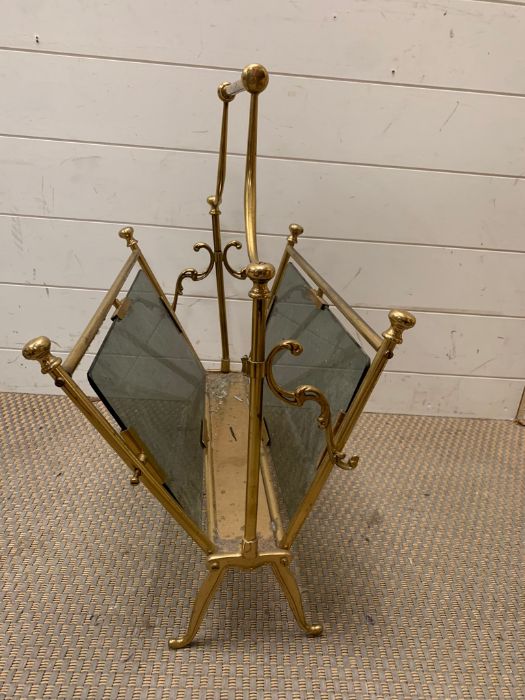 A brass magazine stand with smoked glass AF