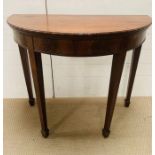 An 19th century mahogany Demi Lune fold over card table (78cm x 92cm)