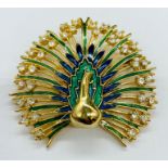 A enamel and diamante peacock brooch