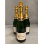 Three bottles of Tattinger Champagne