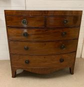 A mahogany bow fronted chest of drawers with string inlay (H108cm W105cm D58cm)