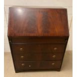 A reproduction bureau with drop down slope opening to pigeon holes and drawers