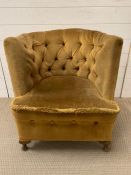 A Heptagon button back chair in velvet upholstery