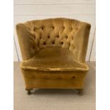 A Heptagon button back chair in velvet upholstery