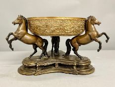 A three horse, spelter, supporting bronze bowl centre piece.