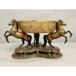 A three horse, spelter, supporting bronze bowl centre piece.