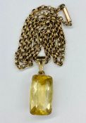 A 9ct gold chain (4.1g Total Weight) and a citrine framed in 9ct gold pendant.