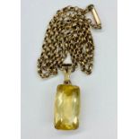A 9ct gold chain (4.1g Total Weight) and a citrine framed in 9ct gold pendant.