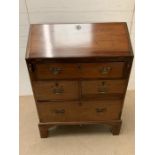 A mahogany bureau on bracket feet, opening to reveal drawers and pigeon holes (H103cm W76cm D47cm)