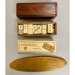 A selection of boxed dominoes and cribbage board