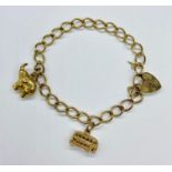 A 9ct gold charm bracelet (Total Weight 5.1g)