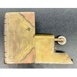 A Trench Art lighter in the form of a book.