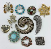 A selection of various brooches