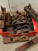 Twelve vintage wooden planes