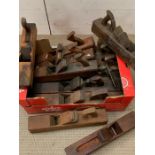 Twelve vintage wooden planes