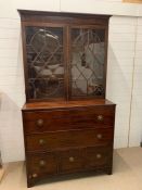 A Regency mahogany secretary bookcase, upper section with two adjustable shelves enclosed by a