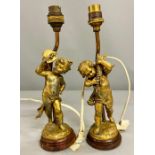 Two gilt cherubs table lamps