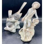 Two pieces of Lladro two birds sitting on a tree and a boy with his dog