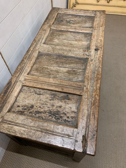 A 17th Century four panelled Coffer with hinged lid raised on bracket feet 135 L x 58 D x 63H - Image 6 of 8
