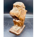 An Antique carved nut cracker in the style of a Monkey.