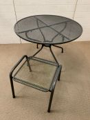 A garden mesh table and foot stool