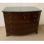 A bow front chest of drawers with side and glass top (H84cm W107cm D58cm)