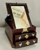 A Chinese jewellery box with two drawers and fold up mirror.