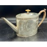 A Silver teapot by George Smith (IV) Hallmarked for London 1790, engraved with wooden handle and