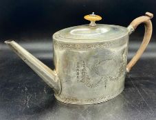 A Silver teapot by George Smith (IV) Hallmarked for London 1790, engraved with wooden handle and