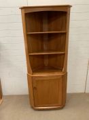 An Ercol corner display unit (H180cm W77cm D47cm)