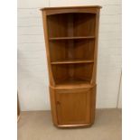 An Ercol corner display unit (H180cm W77cm D47cm)