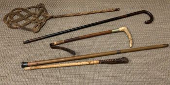 A selection of vintage sticks and walking canes