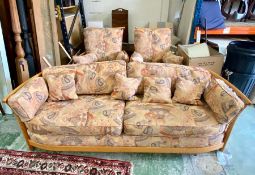 A Ercol three piece sofa set to include a two seater sofa and two arm chairs