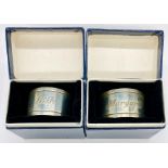 A pair of boxed hallmarked silver napkin rings engraved Billy and Margaret