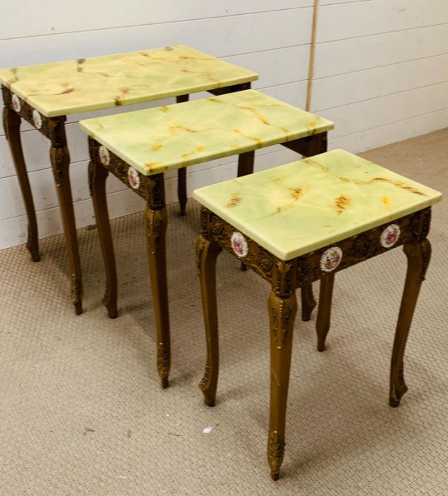 A nest of giltwood tables, inlaid with porcelain mounts and scroll details to side and legs (Largest - Image 9 of 9