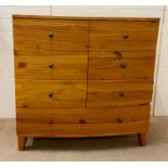 A bow fronted chest of drawers with six small drawers and one long (H114cm W115cm D48cm)