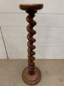 A mahogany spiral turn candle stick stand (H70cm)