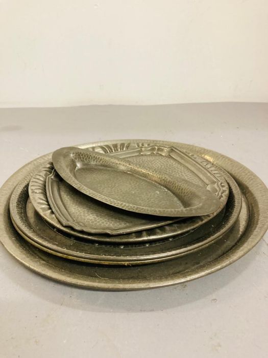 A small selection of various size pewter trays