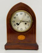 A Domed eight day, mahogany mantle clock with fruitwood inlay.