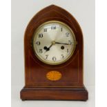 A Domed eight day, mahogany mantle clock with fruitwood inlay.