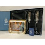 A pair of Champagne flutes and a silver plated tray given as a gift to a member of the Royal