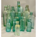 A large collection of turquoise glass bottles