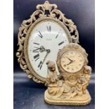 A ornate brass wall clock and mantle clock