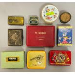 A collection of playing cards along with a cigarette case