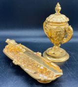 A selection of gilt tableware, knifes and knife rest, caviar holder etc