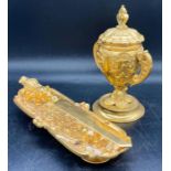 A selection of gilt tableware, knifes and knife rest, caviar holder etc